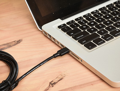 Image of a laptop with a clickshare dongle